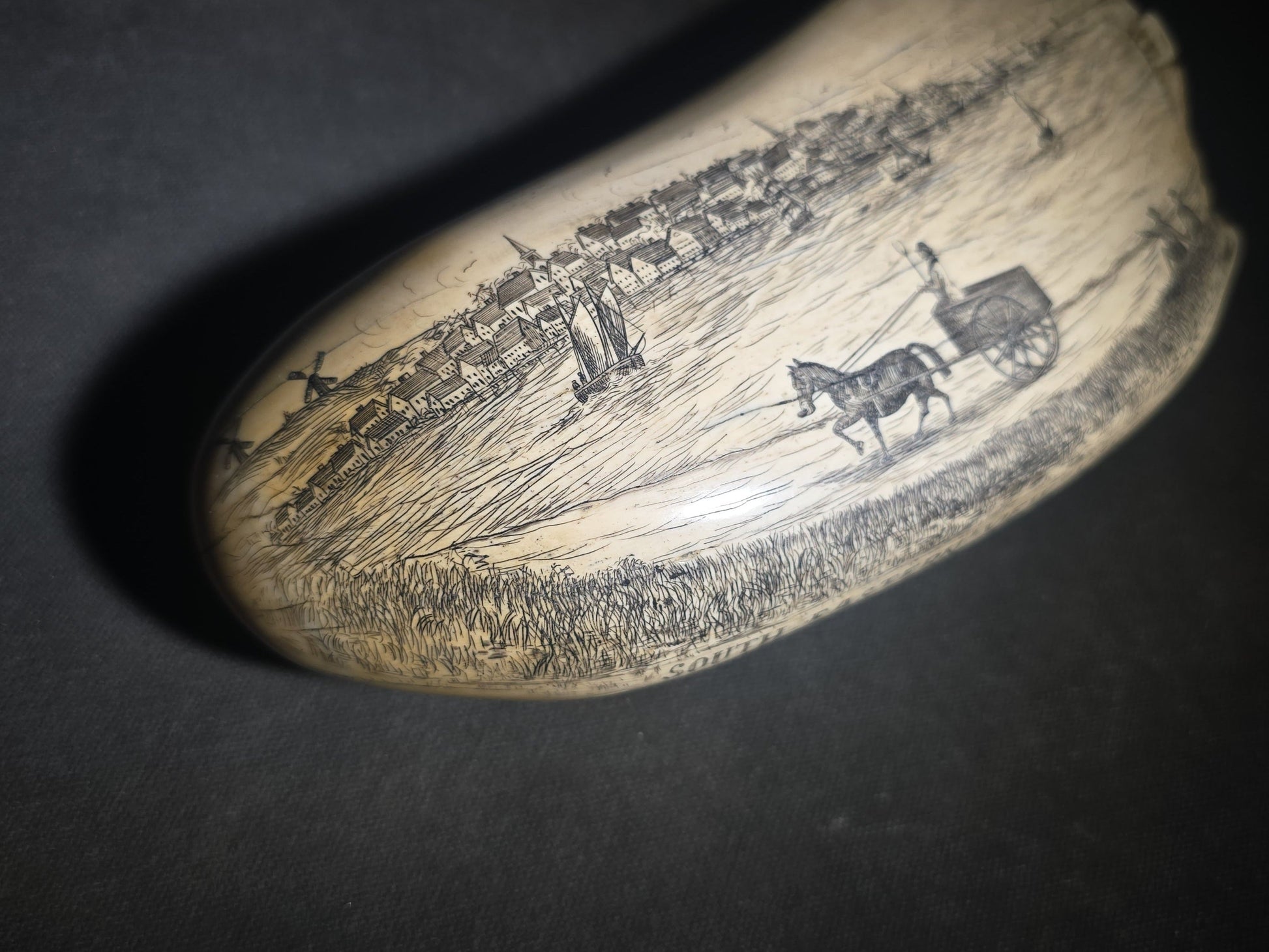 Antique Scrimshaw Whale Tooth engraved with "South Eastern View Nantucket, Mass 1838" Harbor Scene, Town Waterfront, Sailing Vessels, Church Steeples, and Horse-Drawn Cart