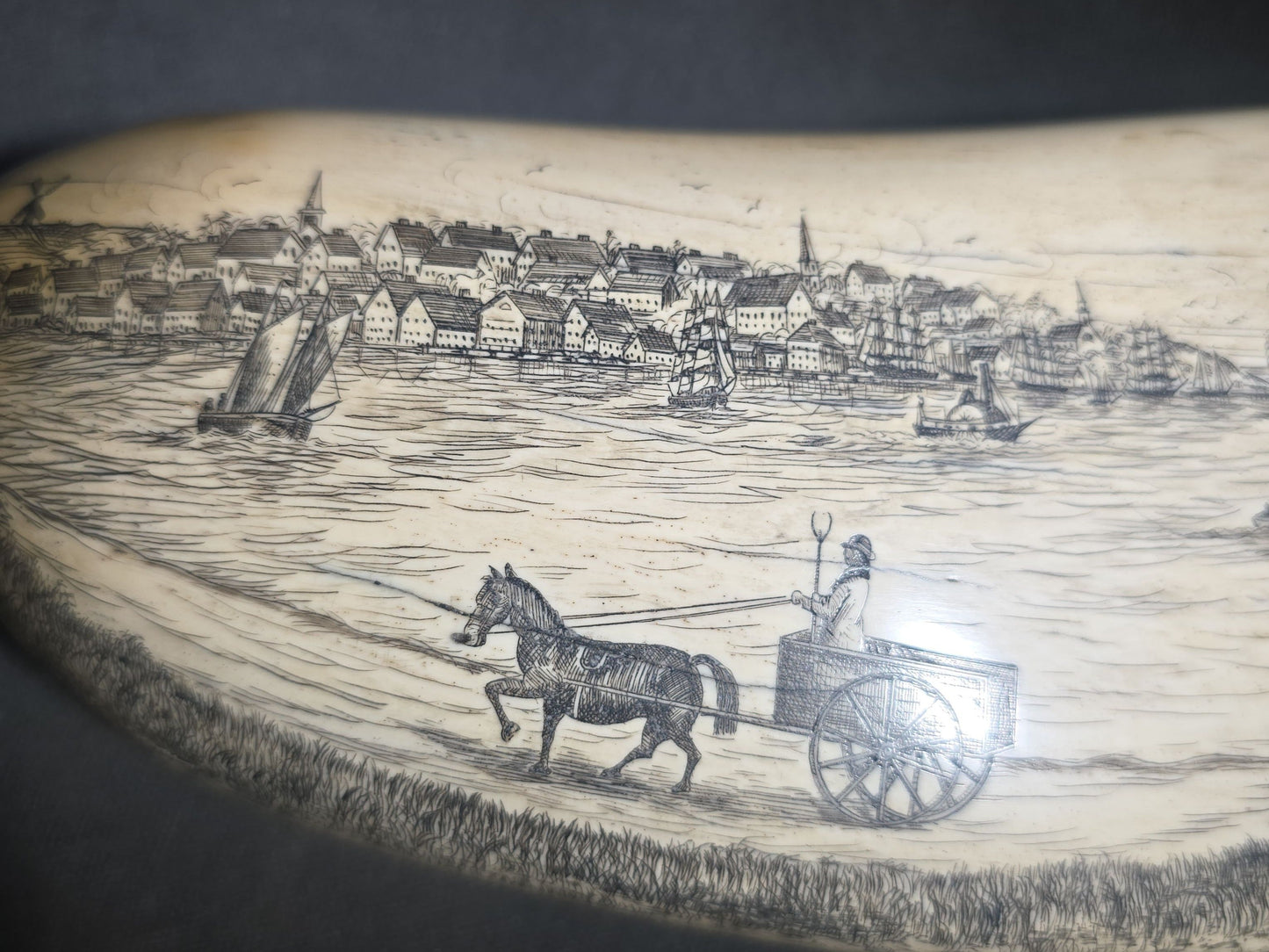 Antique Scrimshaw Whale Tooth engraved with "South Eastern View Nantucket, Mass 1838" Harbor Scene, Town Waterfront, Sailing Vessels, Church Steeples, and Horse-Drawn Cart