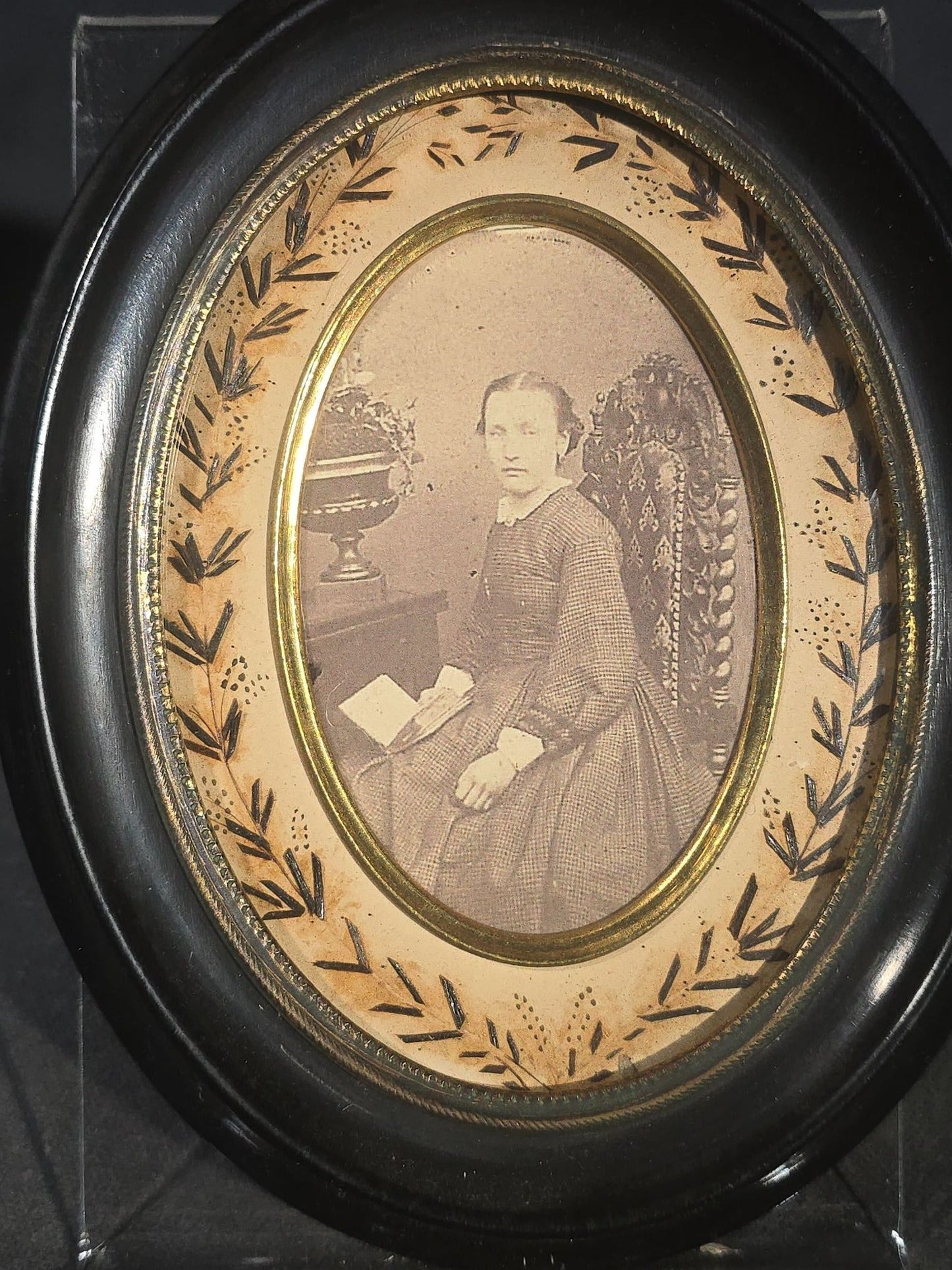 Pair of Antique French Hair Work Mourning Palettes Under Glass in Oval Black Frames including Graveyard Scene Inscribed "Souvenir" and Photograph Portrait of a Young Woman