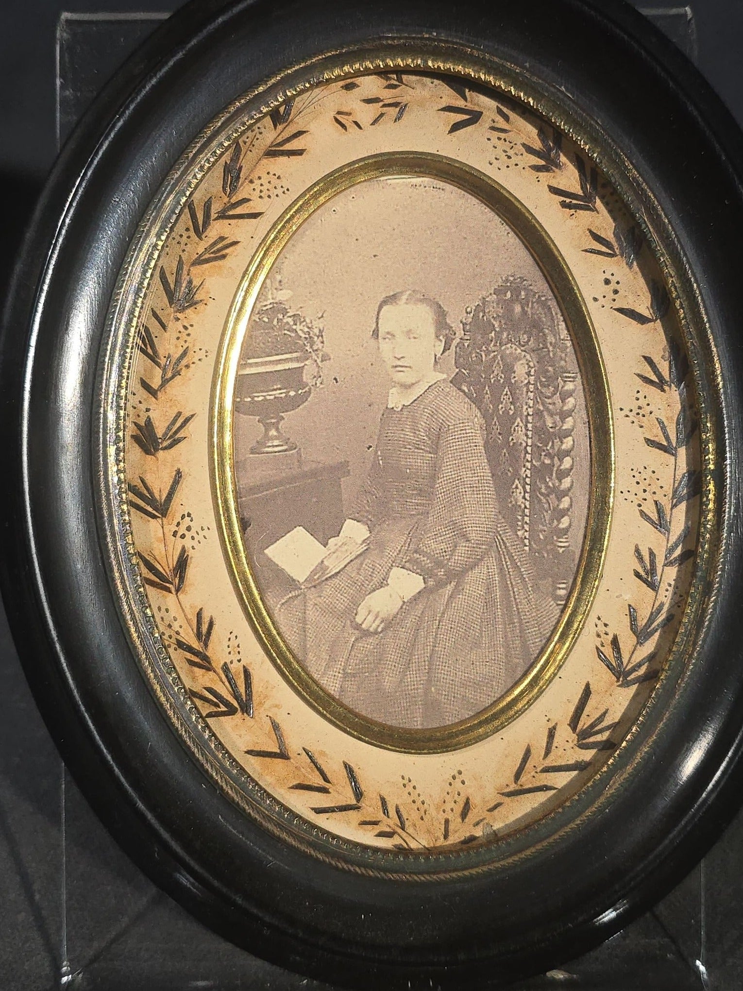 Pair of Antique French Hair Work Mourning Palettes Under Glass in Oval Black Frames including Graveyard Scene Inscribed "Souvenir" and Photograph Portrait of a Young Woman