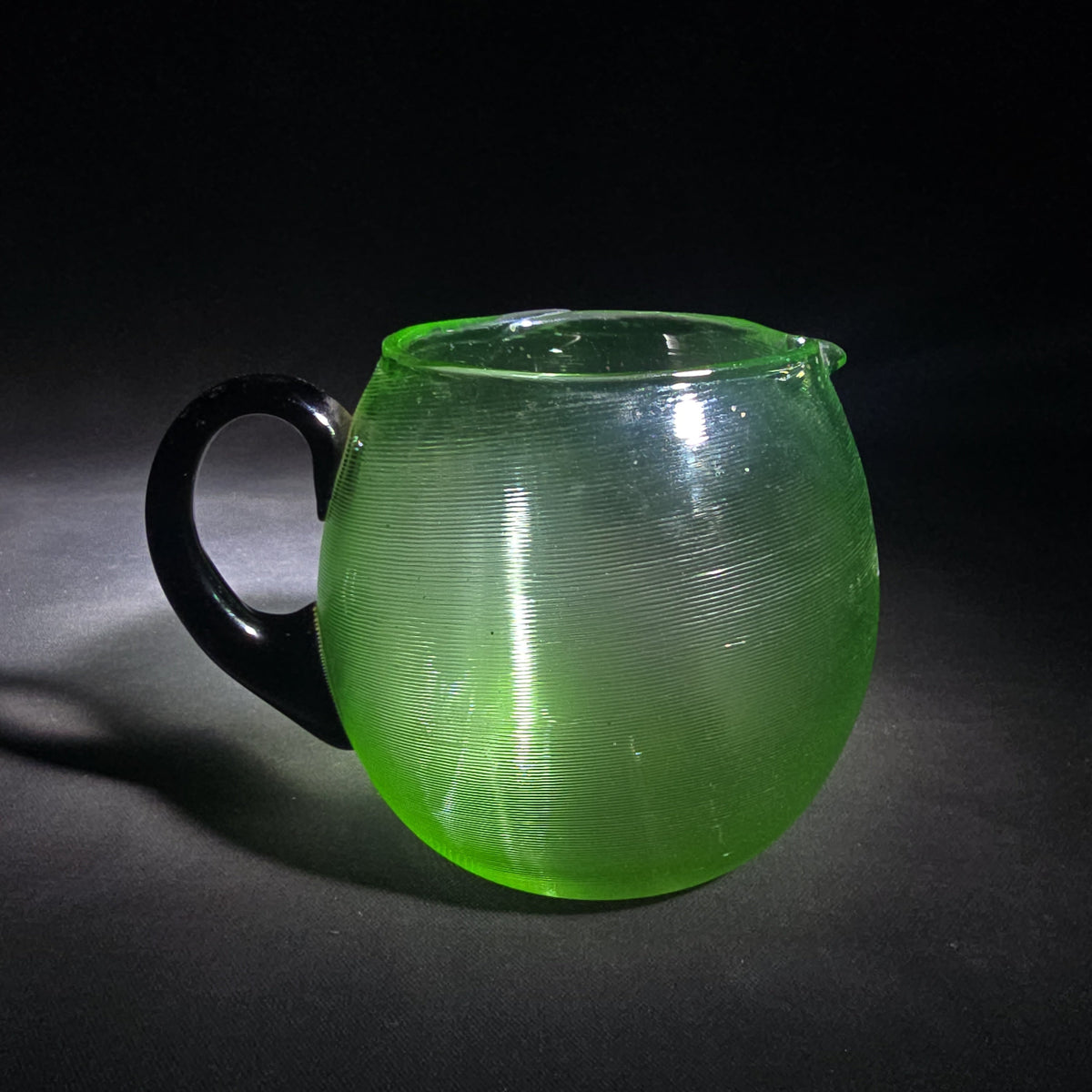 Vintage Hand-Blown Green Uranium Glass Pitcher with Applied Black Handle, UV Reactive