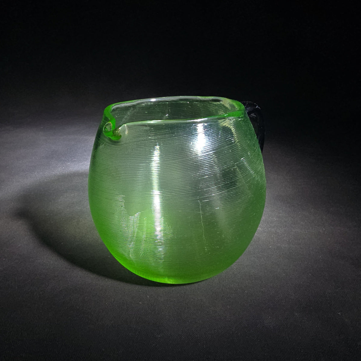 Vintage Hand-Blown Green Uranium Glass Pitcher with Applied Black Handle, UV Reactive