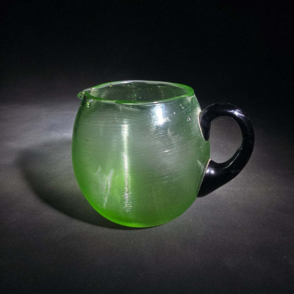 Vintage Hand-Blown Green Uranium Glass Pitcher with Applied Black Handle, UV Reactive
