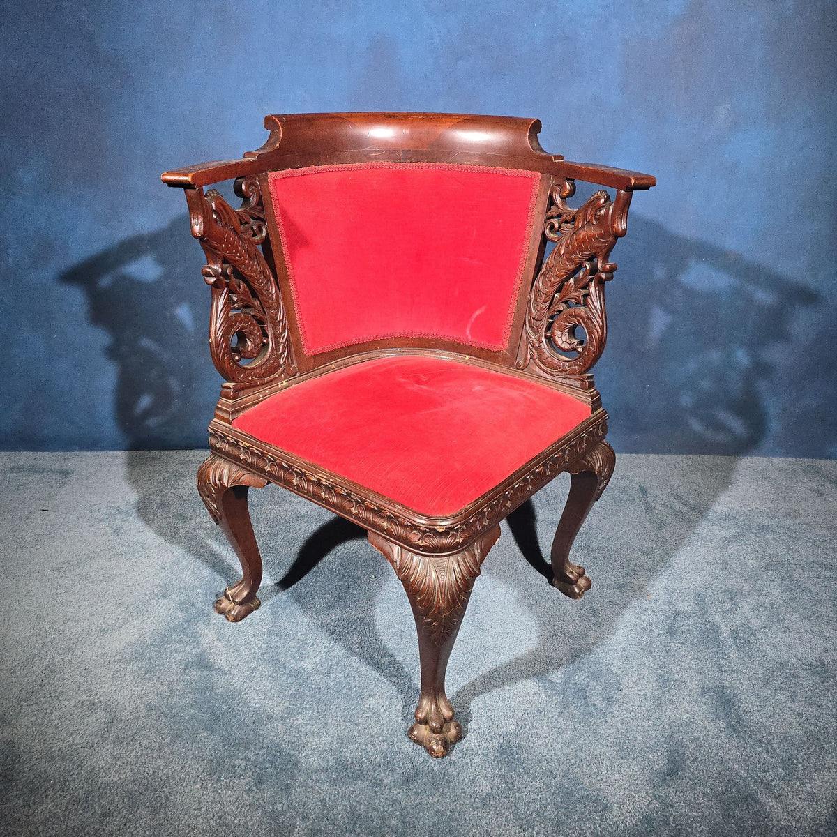 Antique Carved Mahogany Corner Chair with Dolphin Arm Supports and Red Velvet Upholstery