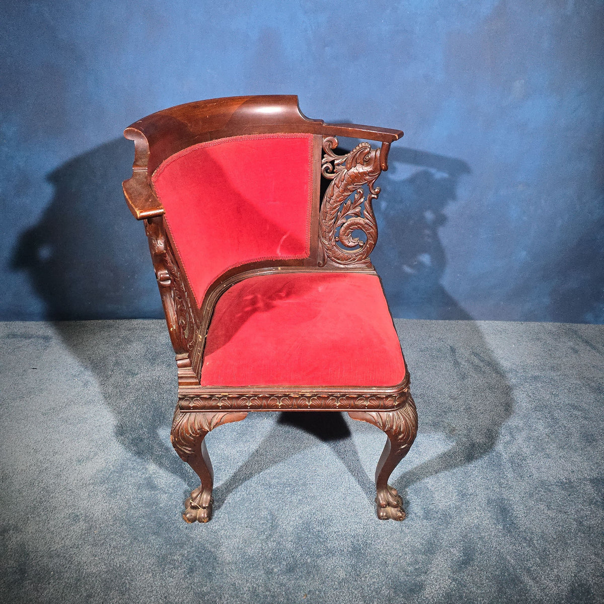 Antique Carved Mahogany Corner Chair with Dolphin Arm Supports and Red Velvet Upholstery