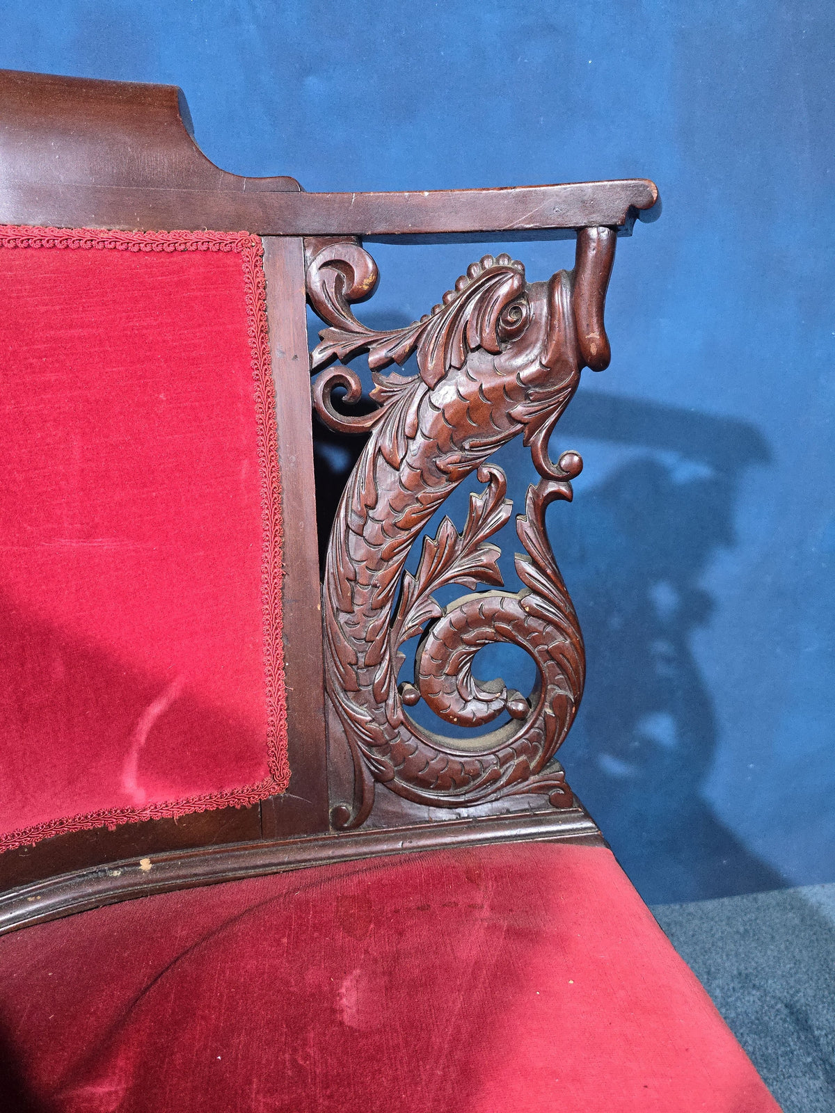 Antique Carved Mahogany Corner Chair with Dolphin Arm Supports and Red Velvet Upholstery