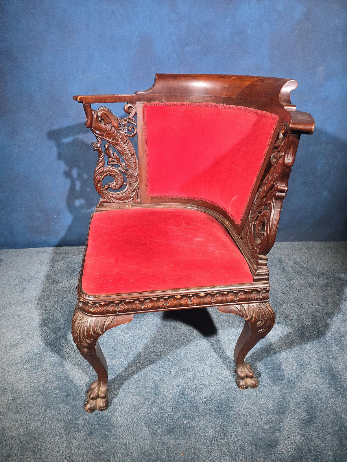 Antique Carved Mahogany Corner Chair with Dolphin Arm Supports and Red Velvet Upholstery