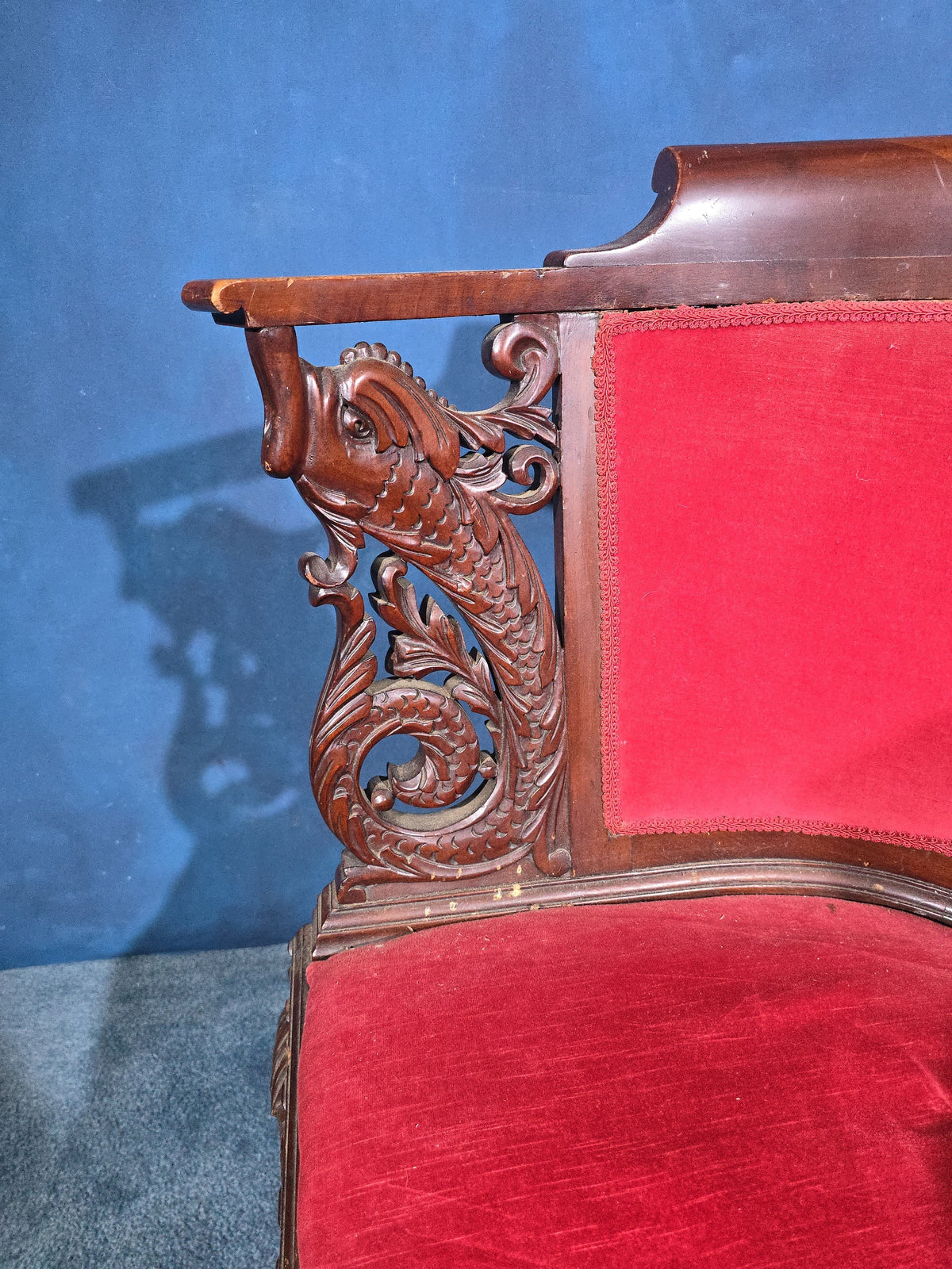 Antique Carved Mahogany Corner Chair with Dolphin Arm Supports and Red Velvet Upholstery