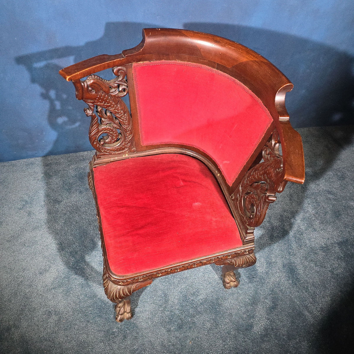 Antique Carved Mahogany Corner Chair with Dolphin Arm Supports and Red Velvet Upholstery