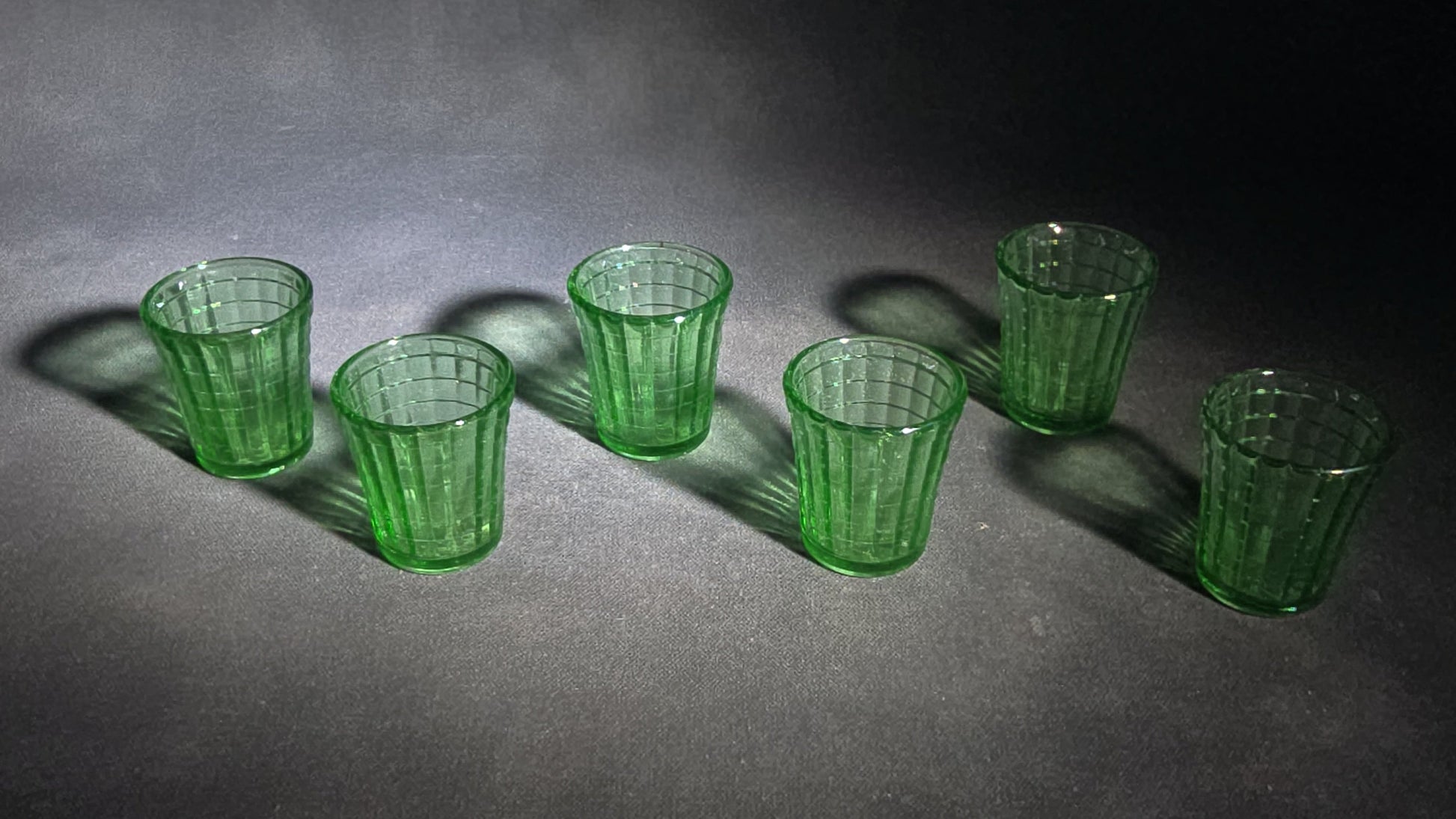 Grouping of Six Vintage Green Uranium Glass Shot Glasses with Paneled Grid Pattern, UV Reactive