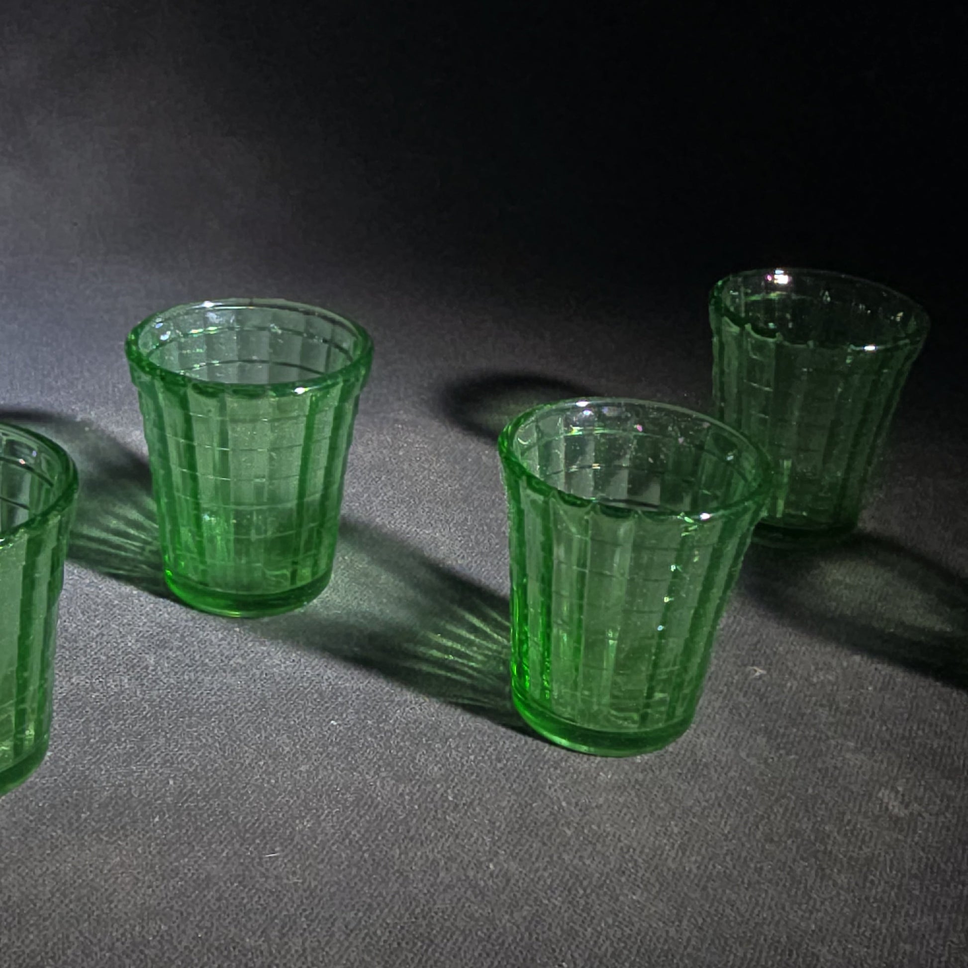 Grouping of Six Vintage Green Uranium Glass Shot Glasses with Paneled Grid Pattern, UV Reactive