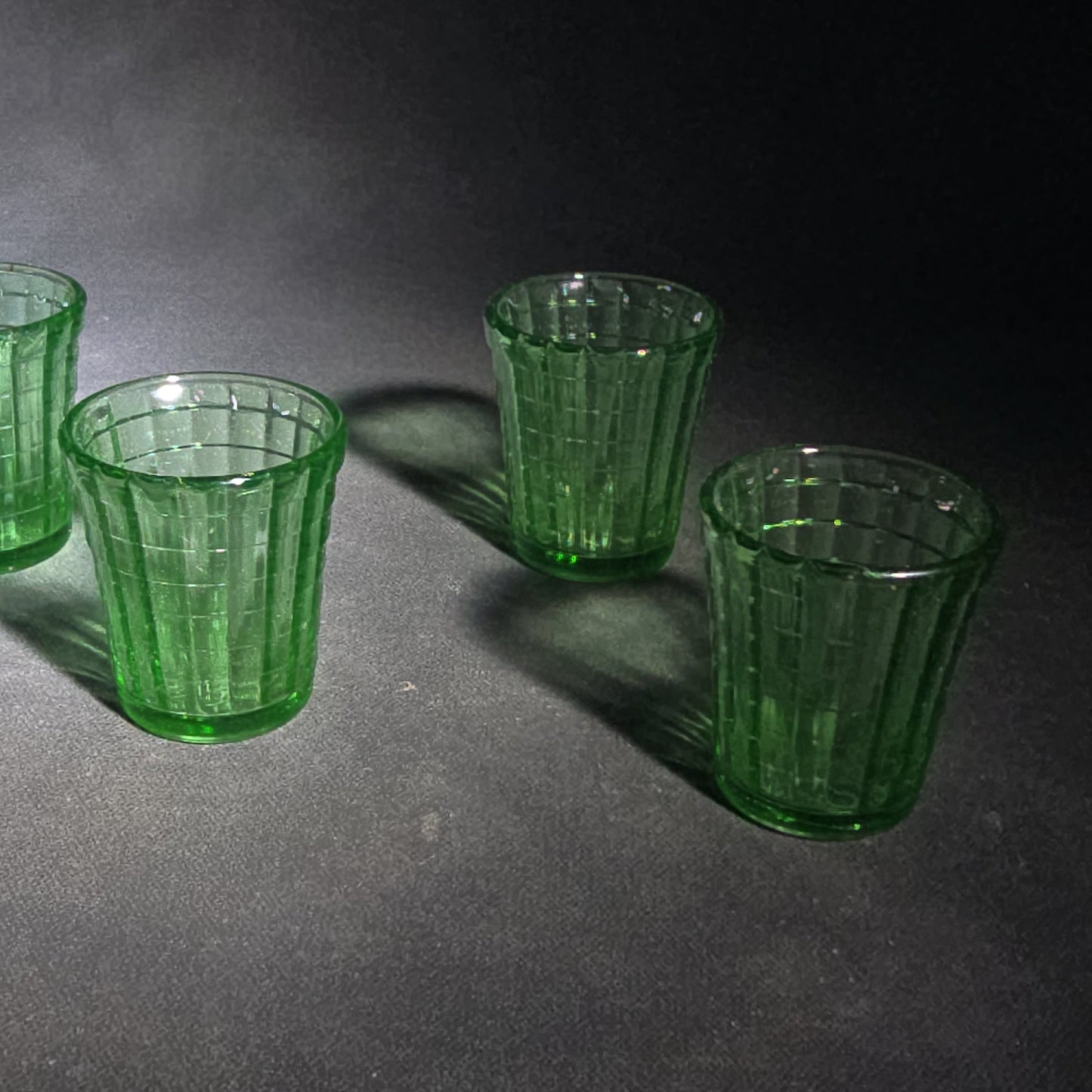 Grouping of Six Vintage Green Uranium Glass Shot Glasses with Paneled Grid Pattern, UV Reactive
