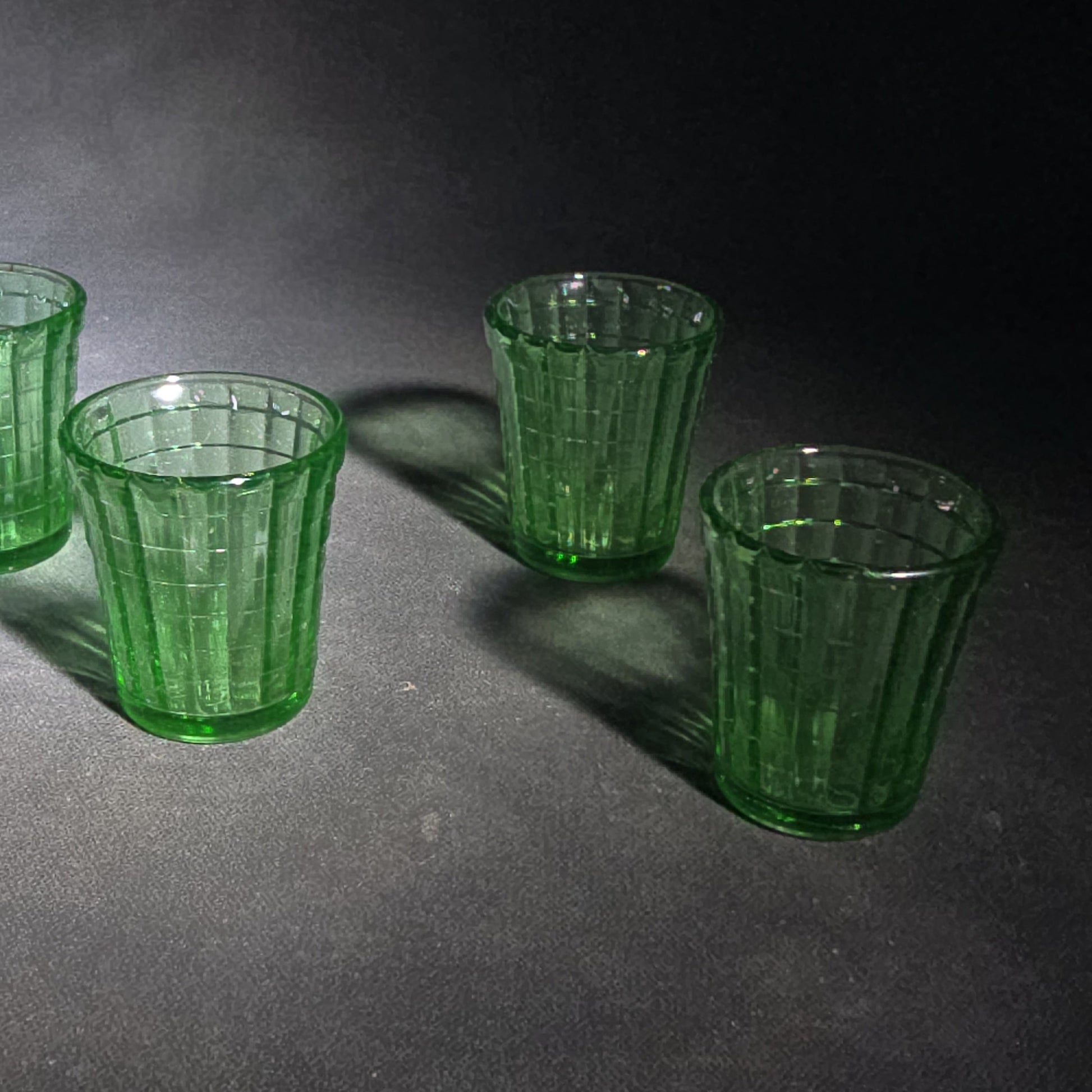 Grouping of Six Vintage Green Uranium Glass Shot Glasses with Paneled Grid Pattern, UV Reactive