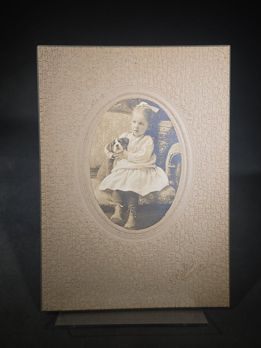 Antique Board-Mounted Photograph of a Young Girl Holding a Puppy, Photographed by Steele, South Deerfield, Massachusetts