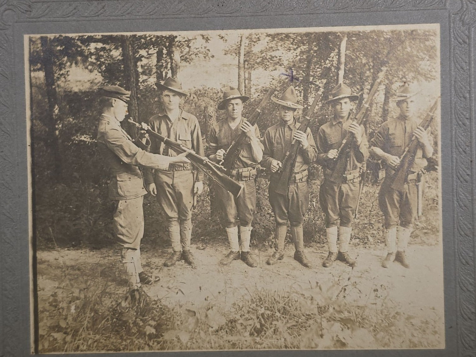 Antique Board-Mounted Photograph of Six WWI-Era Soldiers with Rifles During Inspection