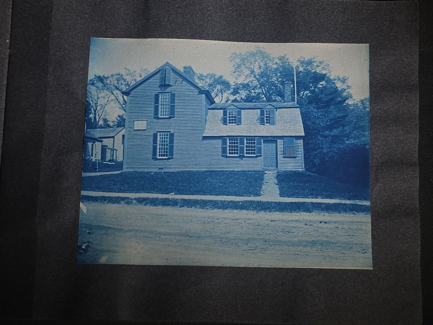 Antique Cyanotype Photo Album Containing Nine Cyanotype Photographs Including Comic Scene with Cow, Colonial House, River Rapids, Park Pond, and Orchard Landscape