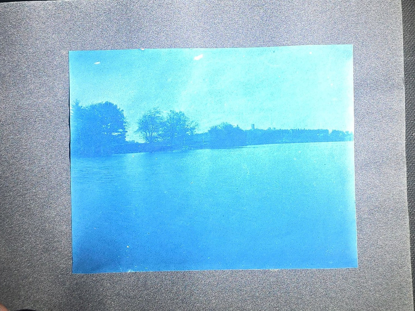 Antique Cyanotype Photo Album Containing Nine Cyanotype Photographs Including Comic Scene with Cow, Colonial House, River Rapids, Park Pond, and Orchard Landscape