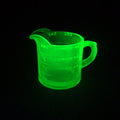 Lot 014 - Antique Uranium Glass Spout Measuring Cup with Embossed Graduated Markings, UV Reactive, 3-1/2" H
