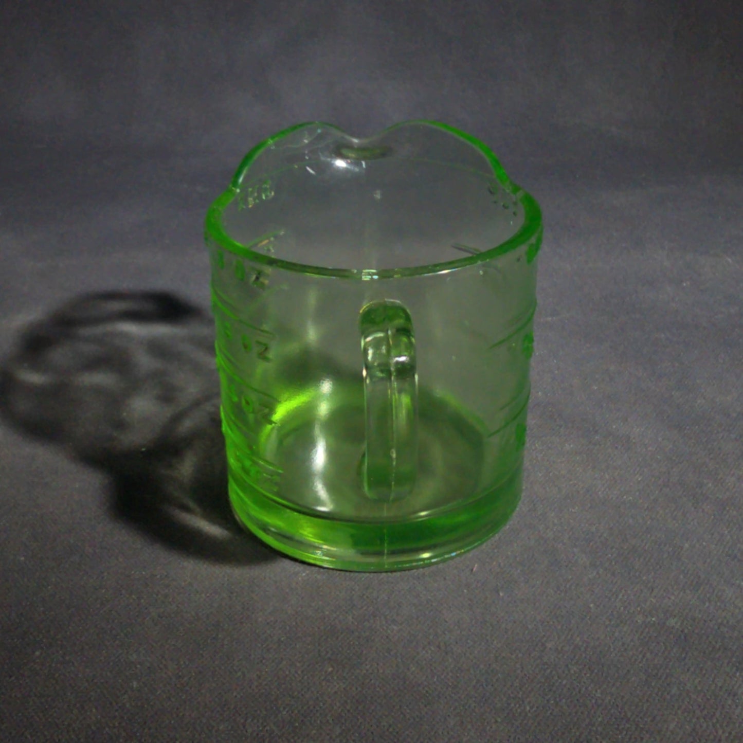 Antique Uranium Glass Spout Measuring Cup with Embossed Graduated Markings, UV Reactive
