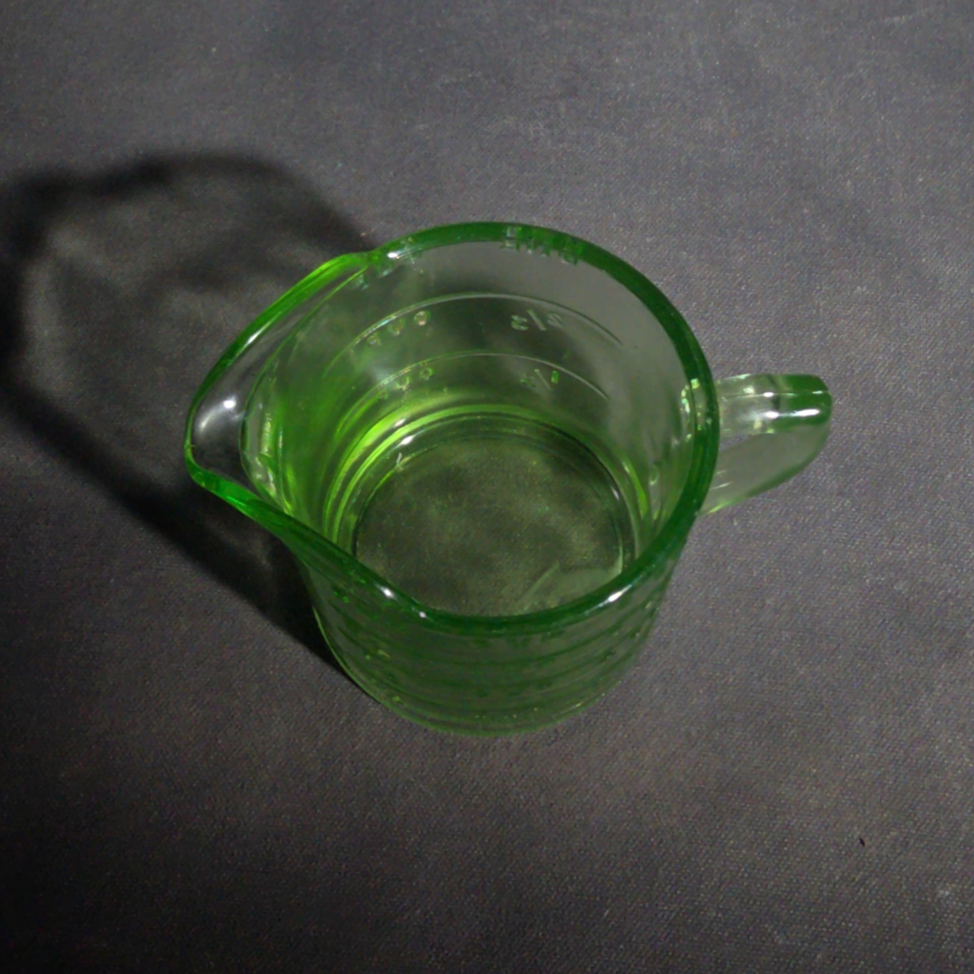 Antique Uranium Glass Spout Measuring Cup with Embossed Graduated Markings, UV Reactive