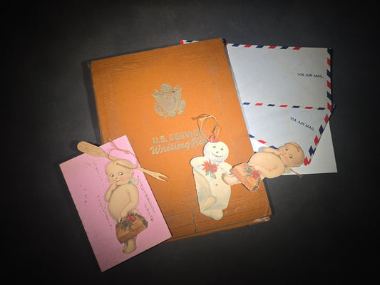 Vintage WWII U.S. Service Writing Kit with Contents including "Armoreader" Camp Polk, Louisiana Newsletter, "The Communique" Newsletter, Chemical Warfare Pocket Reference Card, and Die-Cut Kewpie Christmas Ornaments