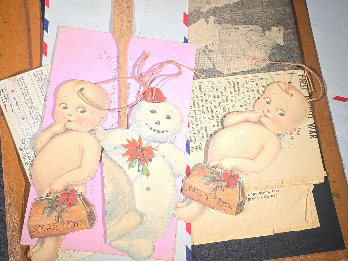 Vintage WWII U.S. Service Writing Kit with Contents including "Armoreader" Camp Polk, Louisiana Newsletter, "The Communique" Newsletter, Chemical Warfare Pocket Reference Card, and Die-Cut Kewpie Christmas Ornaments