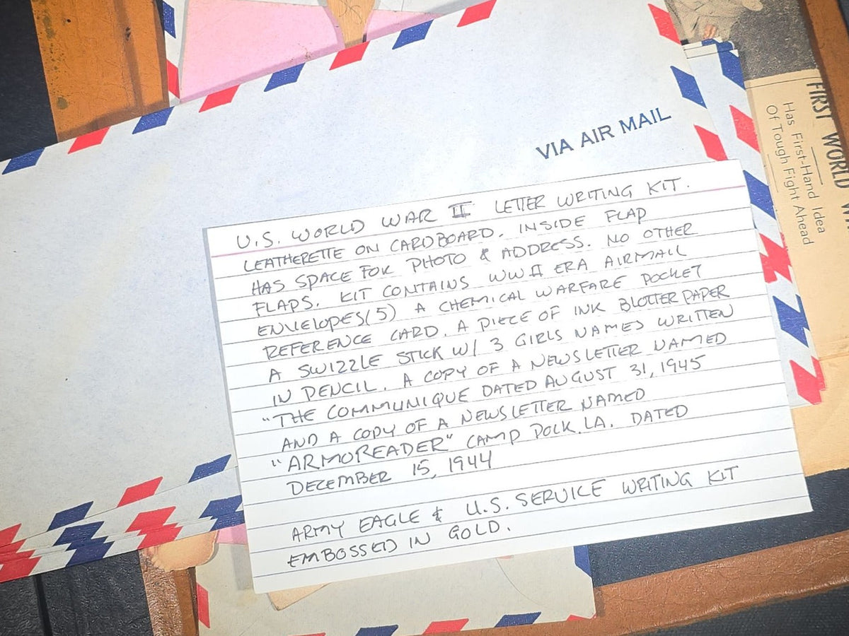 Vintage WWII U.S. Service Writing Kit with Contents including "Armoreader" Camp Polk, Louisiana Newsletter, "The Communique" Newsletter, Chemical Warfare Pocket Reference Card, and Die-Cut Kewpie Christmas Ornaments
