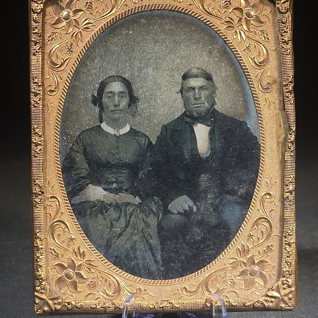 Antique Approximately 1/4th Plate Ruby Ambrotype Photograph of a Seated Couple with Embossed Floral Brass Mat, Uncased