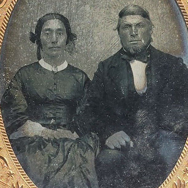 Antique Approximately 1/4th Plate Ruby Ambrotype Photograph of a Seated Couple with Embossed Floral Brass Mat, Uncased
