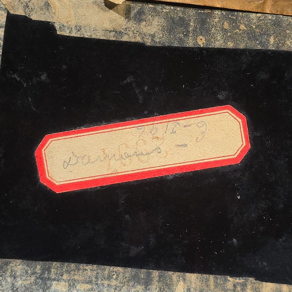 Antique Approximately 1/4th Plate Ruby Ambrotype Photograph of a Seated Couple with Embossed Floral Brass Mat, Uncased
