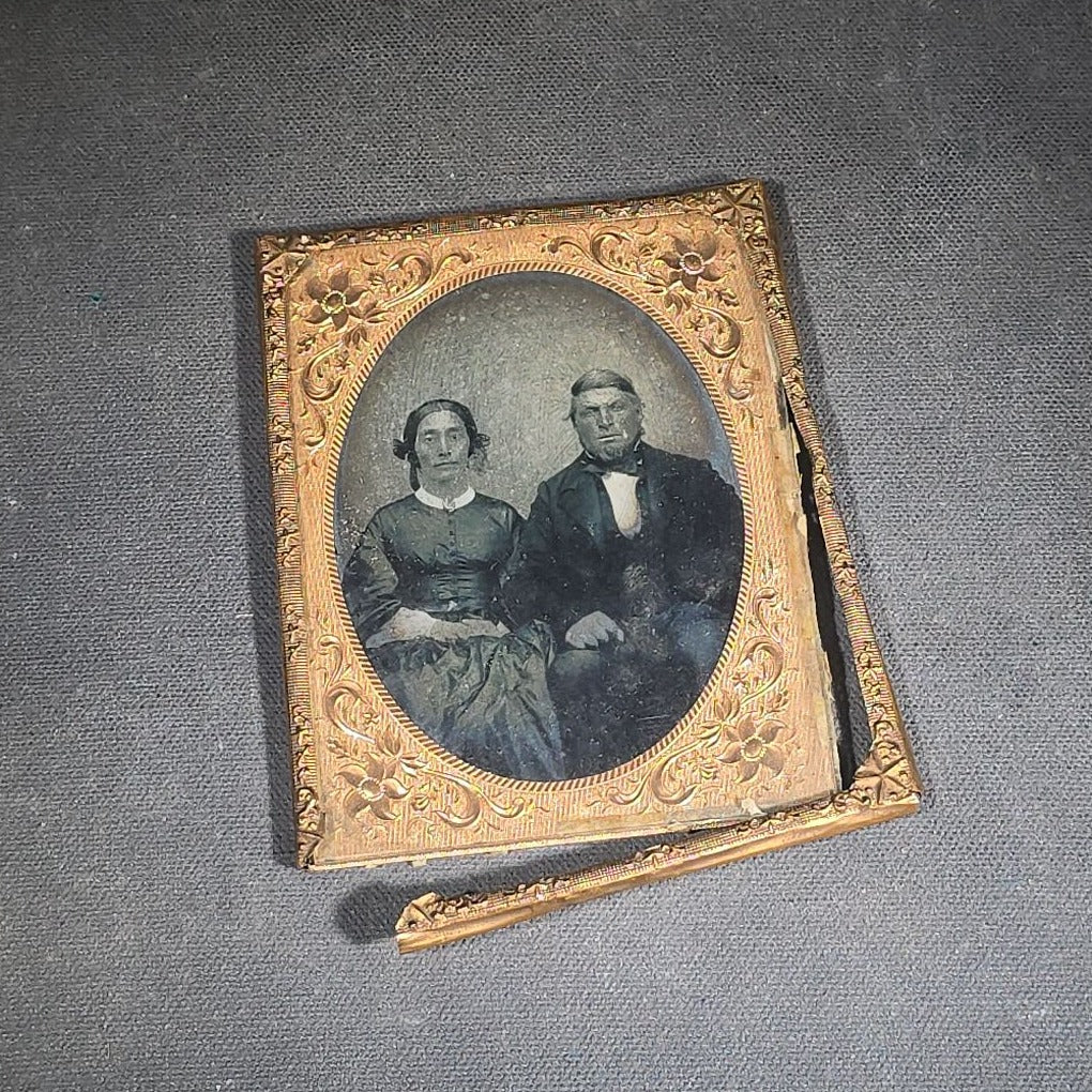 Antique Approximately 1/4th Plate Ruby Ambrotype Photograph of a Seated Couple with Embossed Floral Brass Mat, Uncased