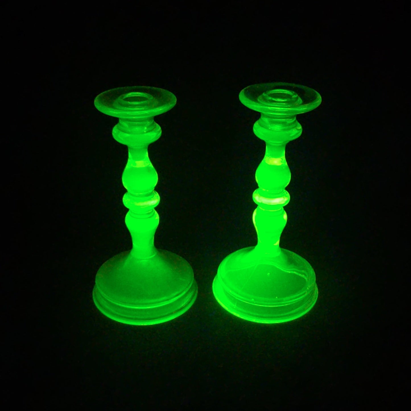 Pair of Antique Uranium Glass Candlesticks with Baluster Stems and Round Bases, UV Reactive
