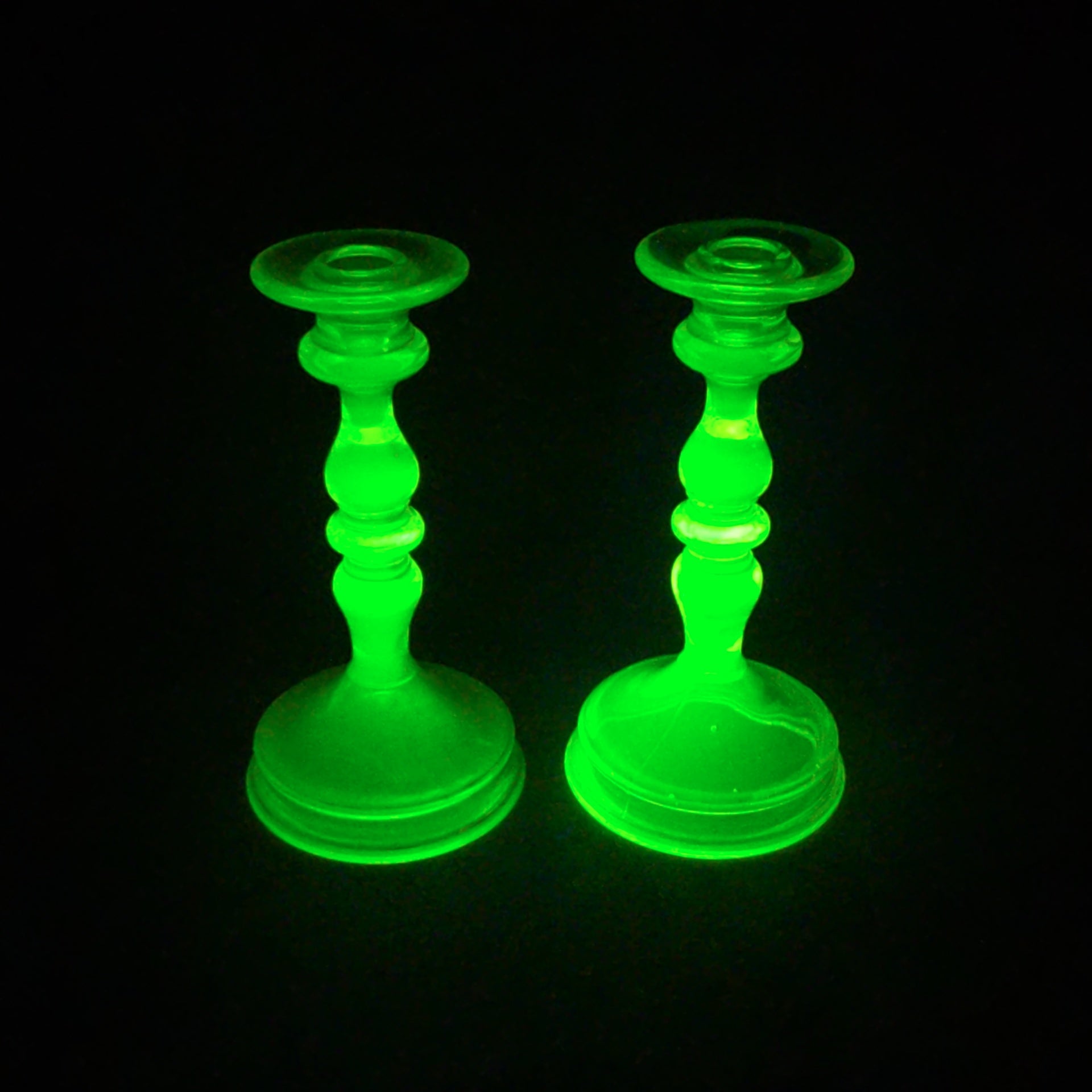 Pair of Antique Uranium Glass Candlesticks with Baluster Stems and Round Bases, UV Reactive