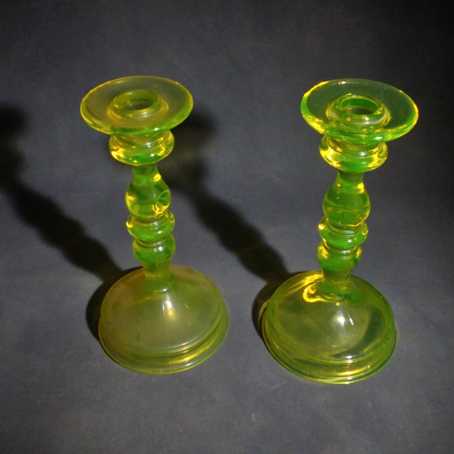 Pair of Antique Uranium Glass Candlesticks with Baluster Stems and Round Bases, UV Reactive