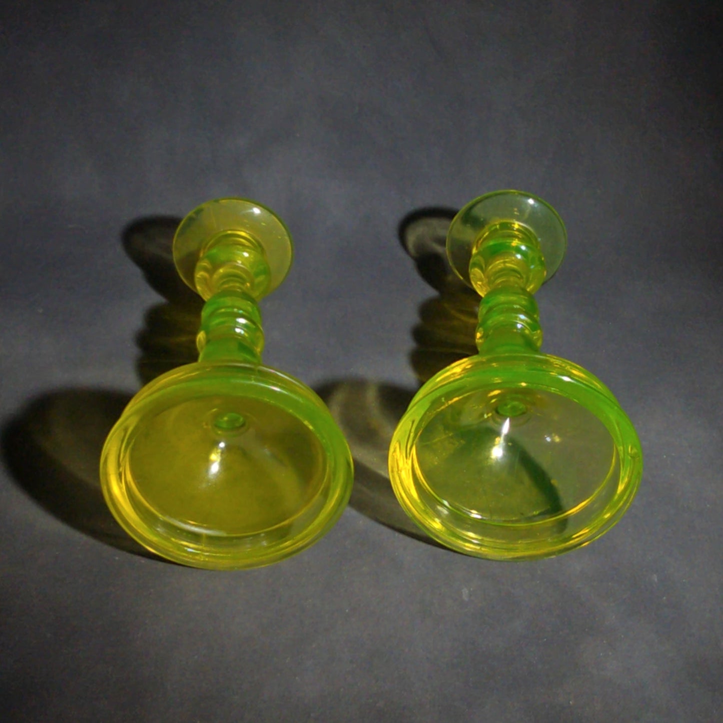Pair of Antique Uranium Glass Candlesticks with Baluster Stems and Round Bases, UV Reactive