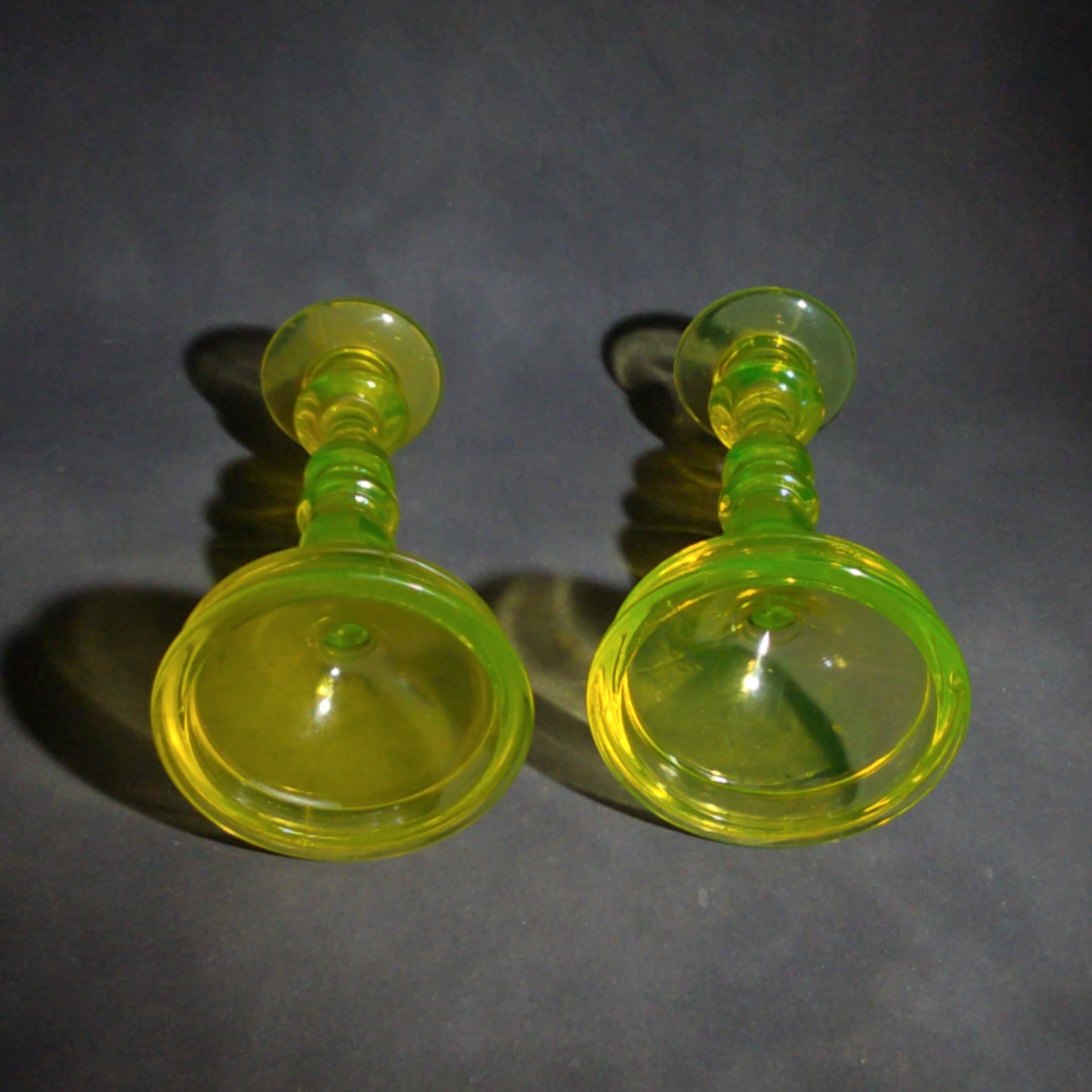 Pair of Antique Uranium Glass Candlesticks with Baluster Stems and Round Bases, UV Reactive