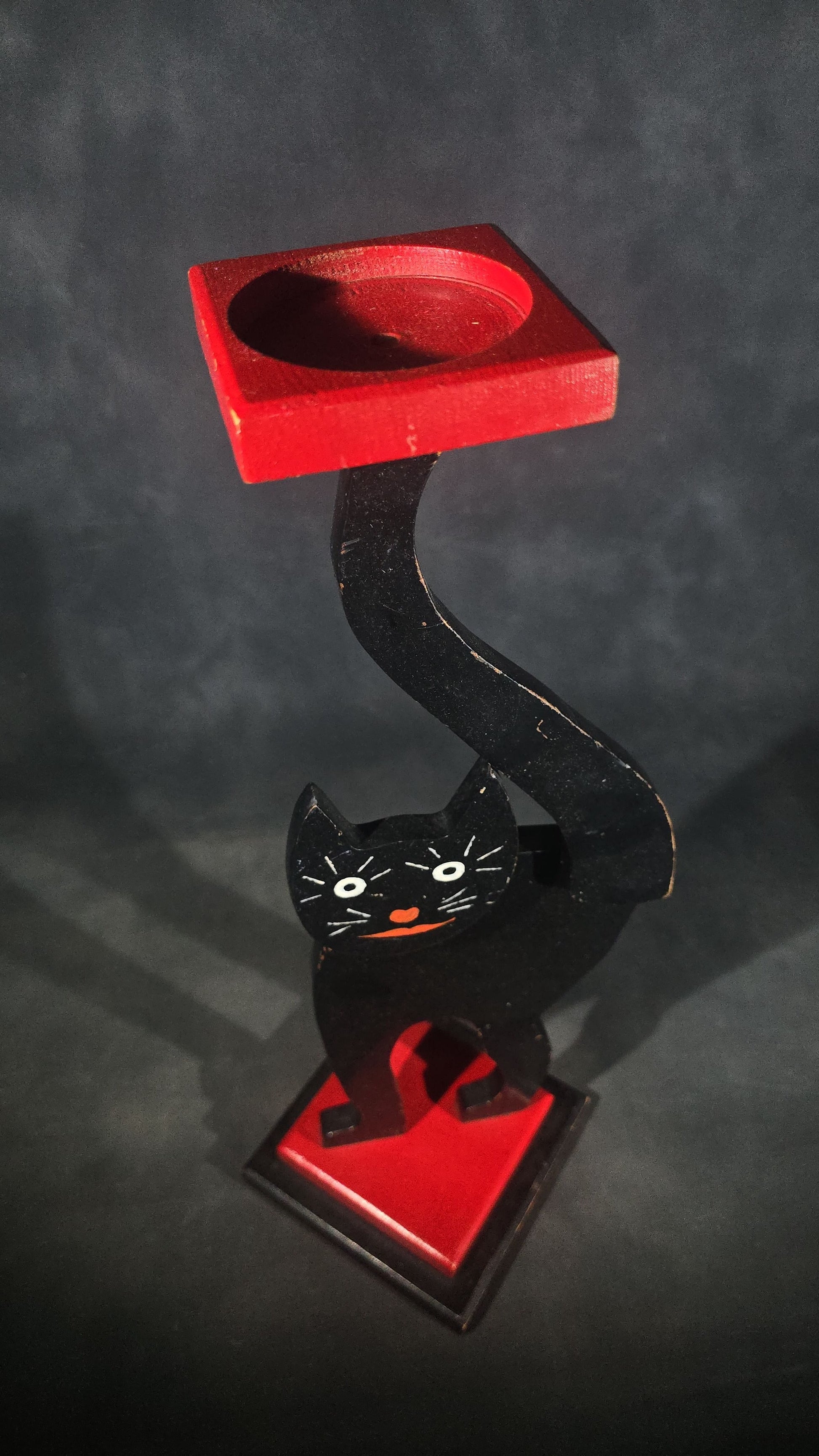 Vintage Hand-Painted Wooden Folk Art Black Cat Smoking Stand with Arched Back and Raised Tail, Red and Black Stepped Base