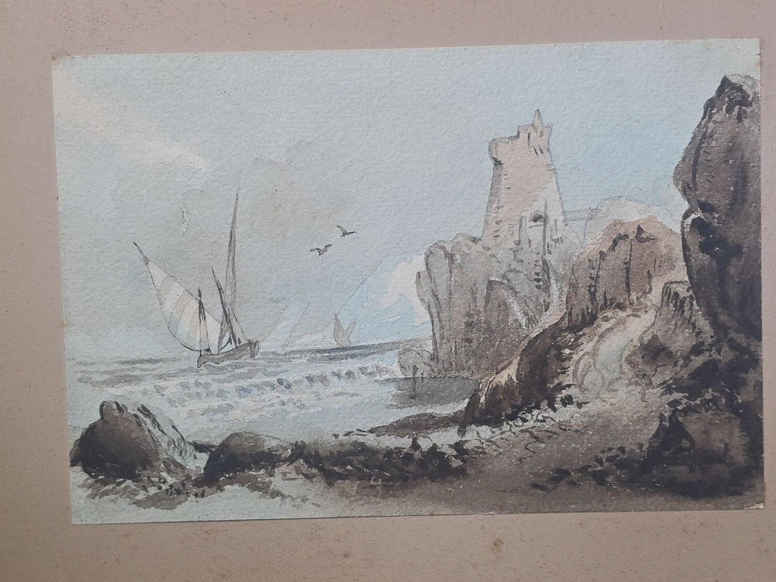 Antique Watercolor Painting on Paper, Coastal Scene with Rocky Cliffs, Tower Ruin, and Sailing Vessels, in Gilt Wood Frame