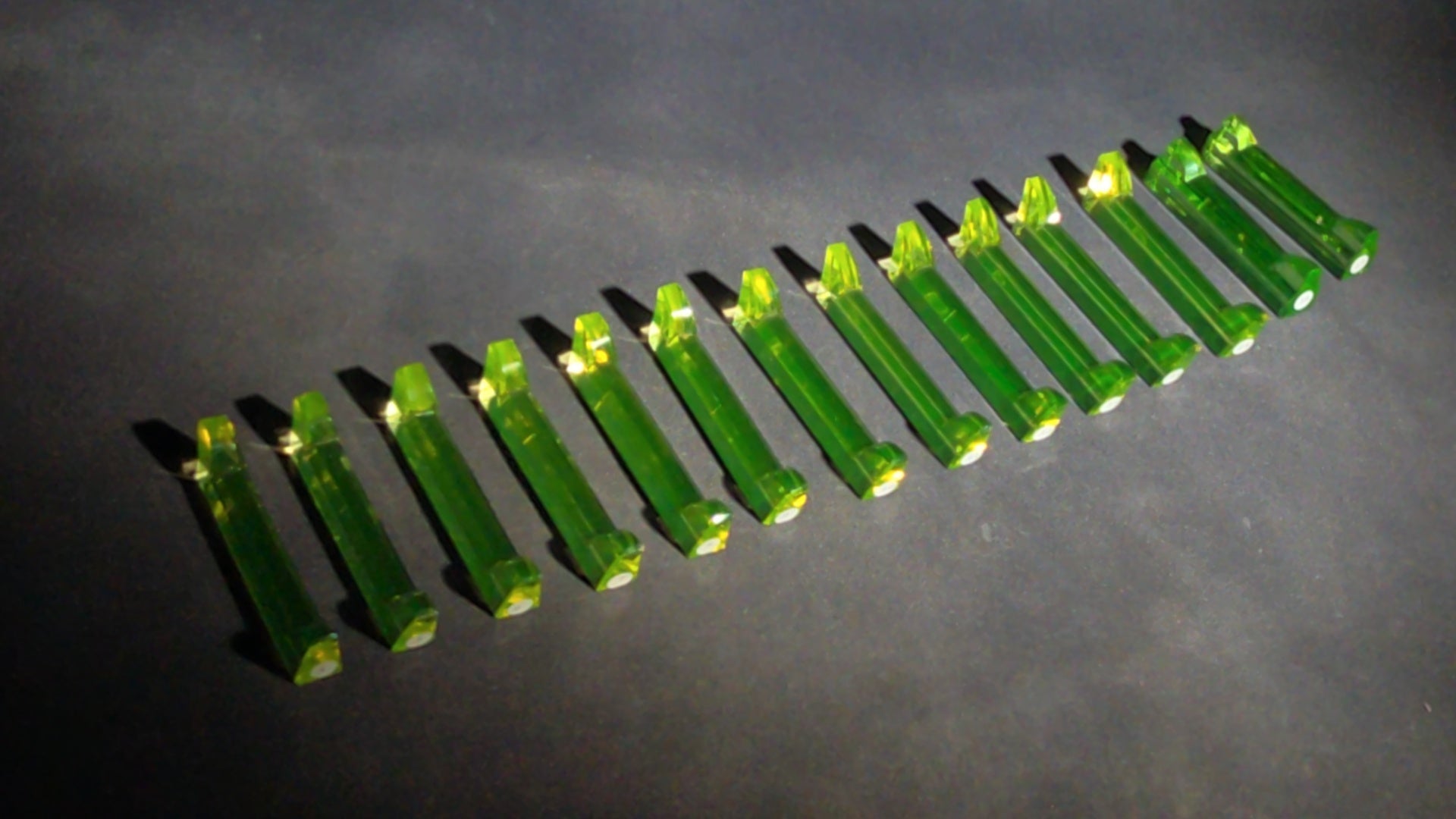Grouping of 14 Antique Uranium Glass Knife Rests, UV Reactive, Numbered