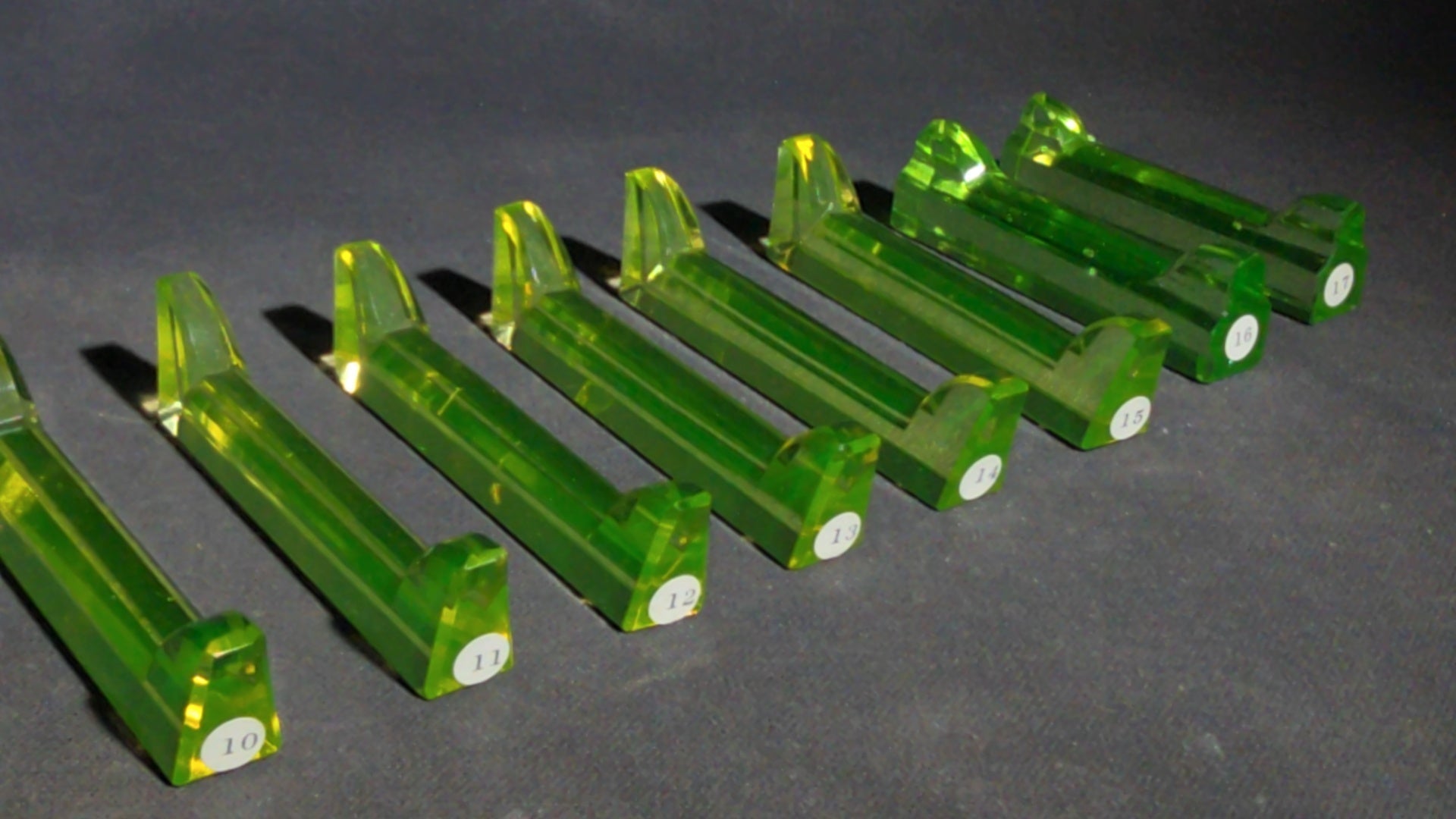 Grouping of 14 Antique Uranium Glass Knife Rests, UV Reactive, Numbered