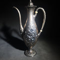 Lot 006 - Antique Gorham Sterling Silver After-Dinner Coffee Pot with Repousse Floral Decoration, Engraved 1879 and 1904 Silver Anniversary Dates, Pattern 5665, 1-1/2 Pint, 12-1/2" H, Total Weight 576 g