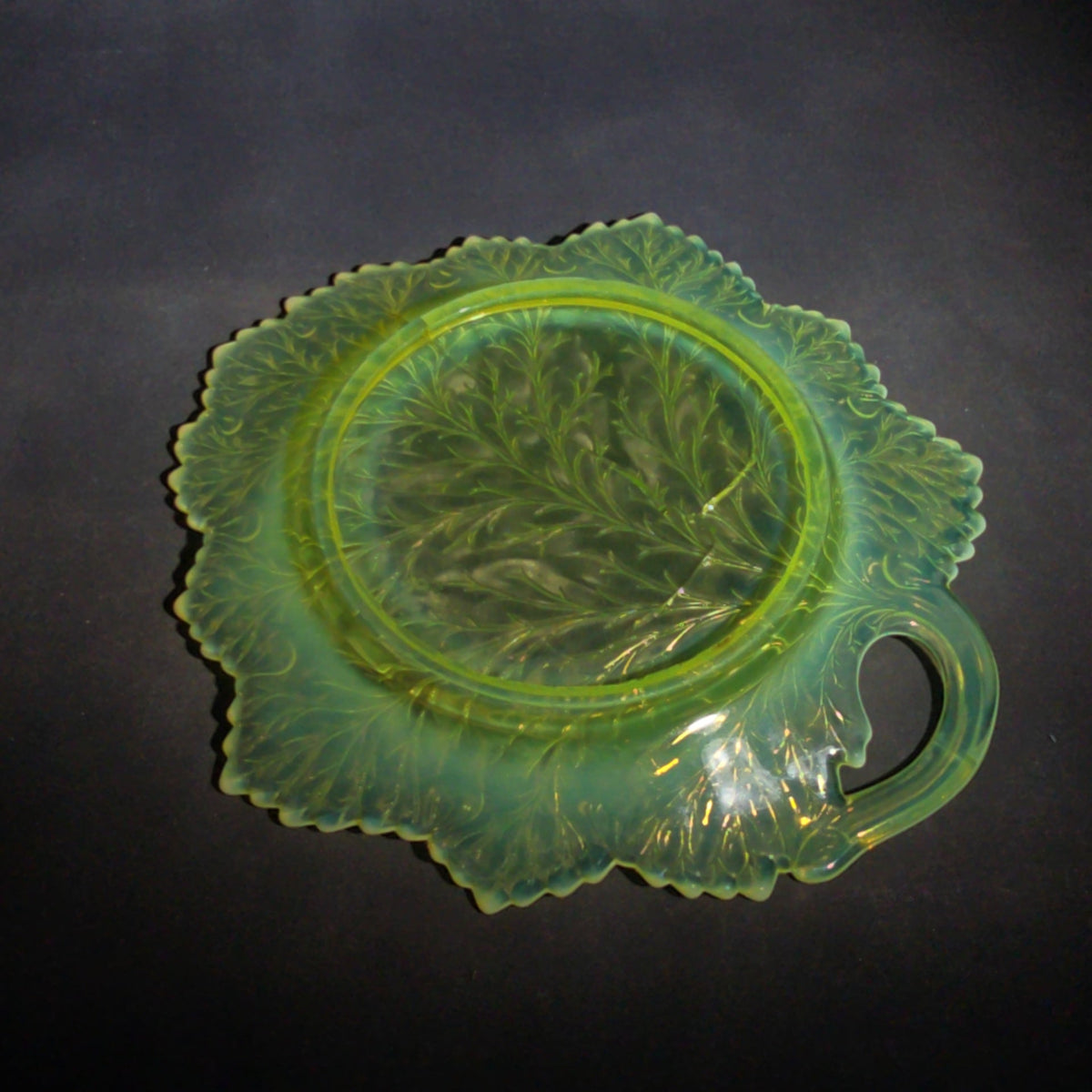 Antique Pressed Uranium Glass Leaf-Form Handled Dish, UV-Reactive, Note Severely Cracked, Poor Condition