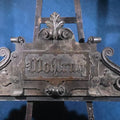 Lot 013 - Antique Carved Wood Architectural Pediment with German Fraktur Inscription "Wohlruh" ("Peaceful Rest"), 65-1/2" L x 28-1/2" H