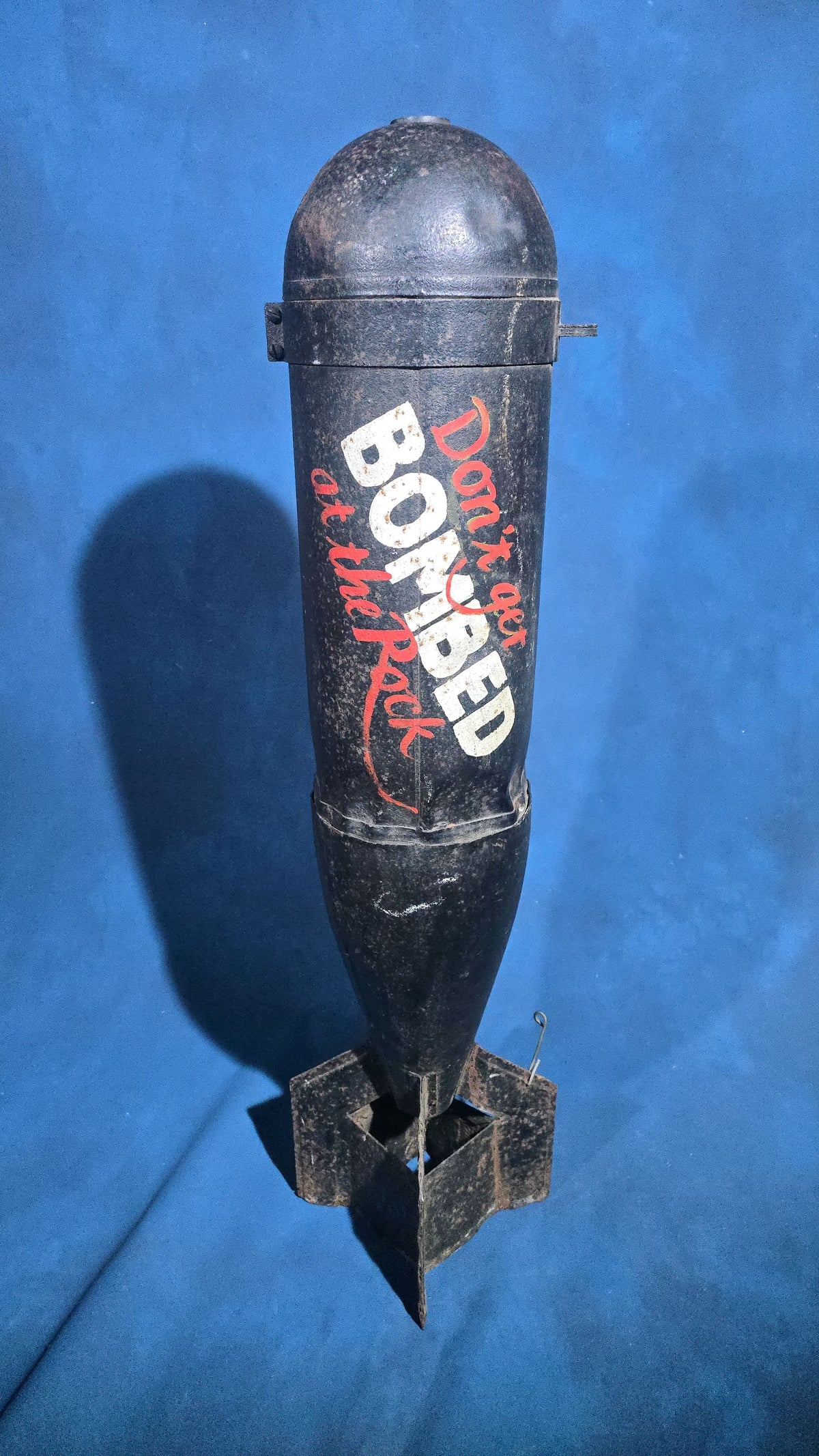Vintage Bomb-Shaped Novelty Trade Sign, "Don't Get Bombed at the Rock," Hand-Lettered with Two Hanging Points