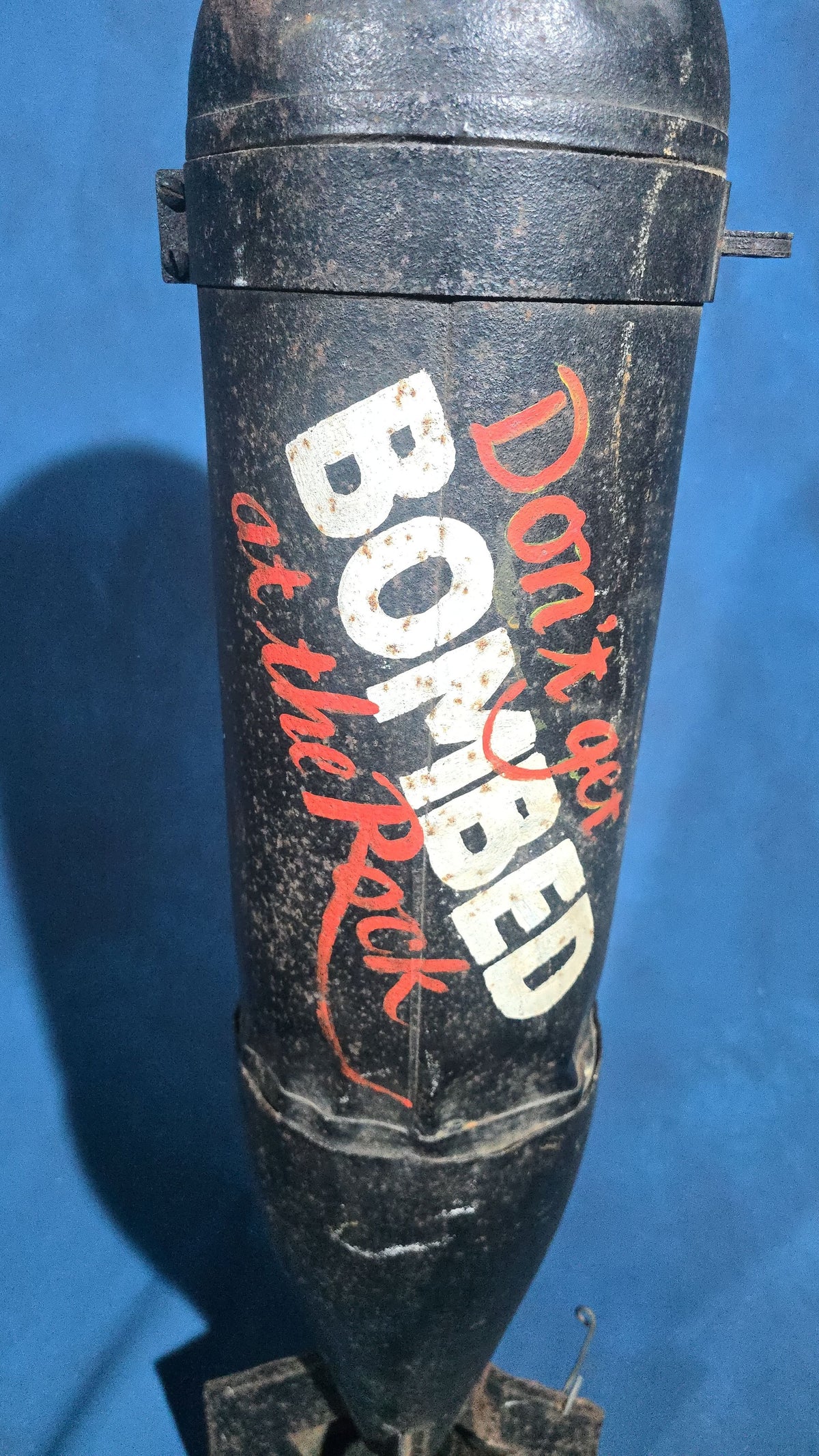 Vintage Bomb-Shaped Novelty Trade Sign, "Don't Get Bombed at the Rock," Hand-Lettered with Two Hanging Points