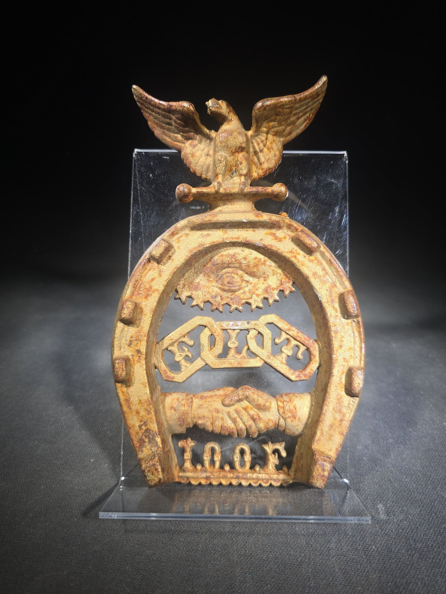 Antique Cast Iron Independent Order of Odd Fellows I.O.O.F. Horseshoe Ornament with Eagle, All-Seeing Eye, Three-Link Chain "F.L.T.," and Clasped Hands