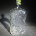 Lot 021 - Antique Hiram Walker Spider Web Clear Glass Whiskey Bottle with Green Screw Cap, 8" H