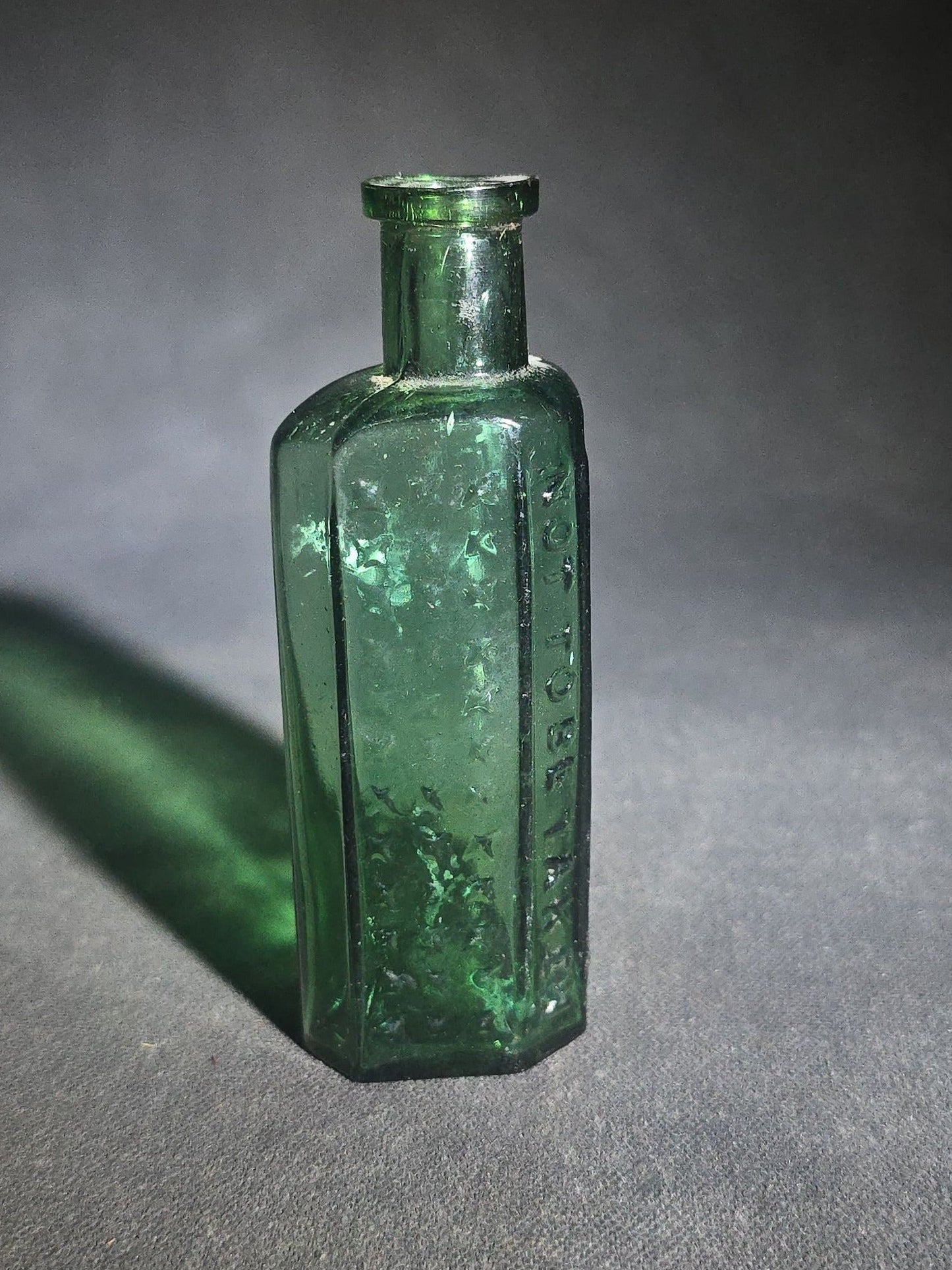 Antique Green Glass Hexagonal Poison Bottle Embossed "Not to Be Taken" with Cross-Hatch Hobnail Pattern and Vertical Ribs