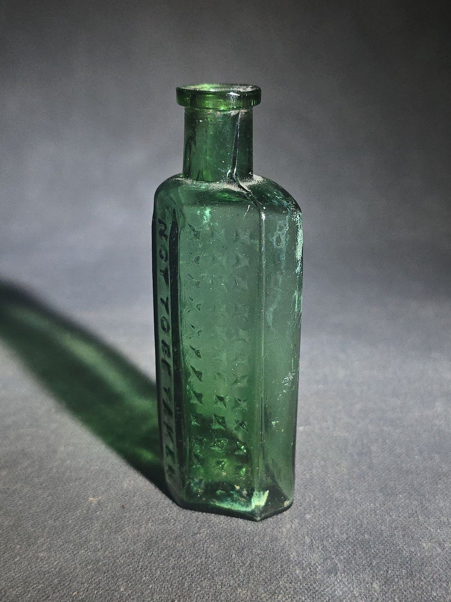 Antique Green Glass Hexagonal Poison Bottle Embossed "Not to Be Taken" with Cross-Hatch Hobnail Pattern and Vertical Ribs