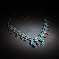 Lot 025 - Vintage Navajo Sterling Silver and Turquoise Squash Blossom Necklace with Naja Pendant, Signed L. Hill, Attributed to Les Hill, Circa 1970s, 24" H, Total Weight 93.27 g